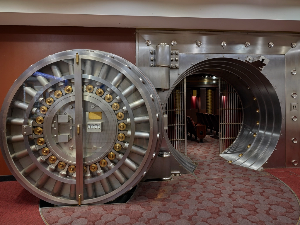 A round steel bank vault door standing open