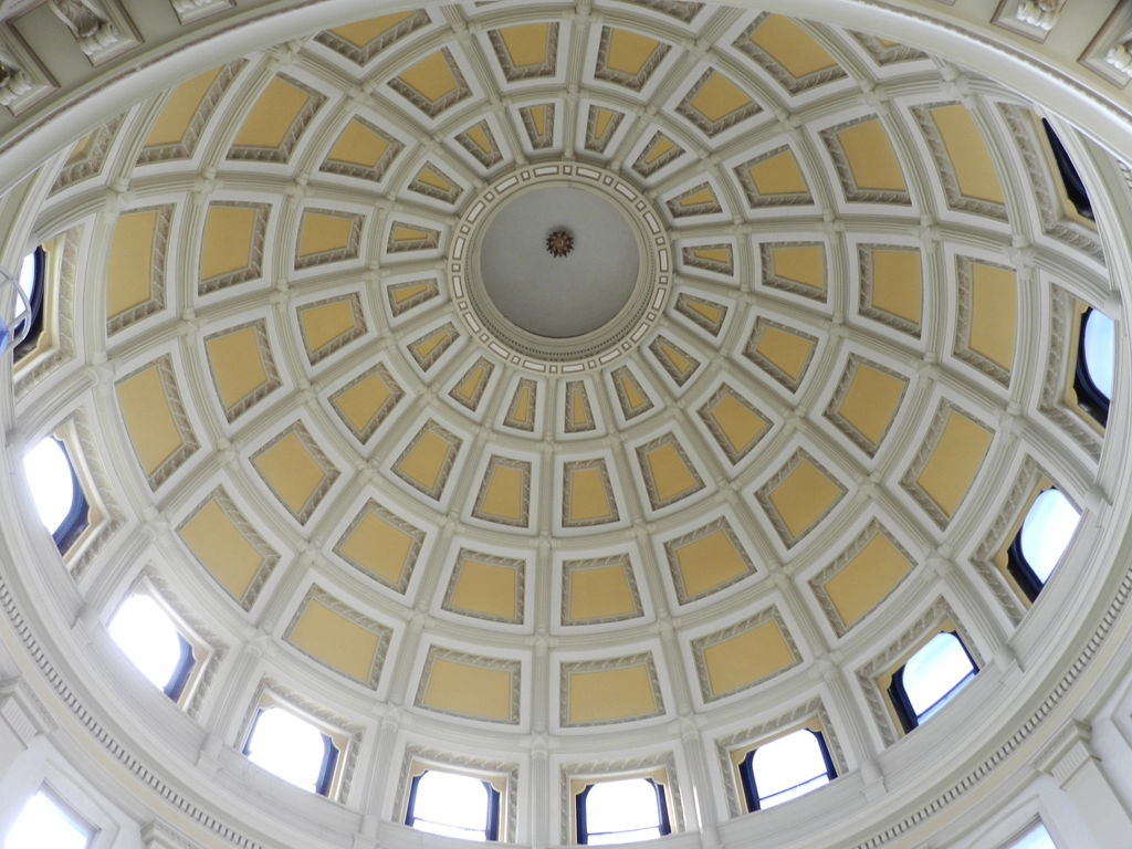 Looking up into the coffered dome of a capitol rotunda